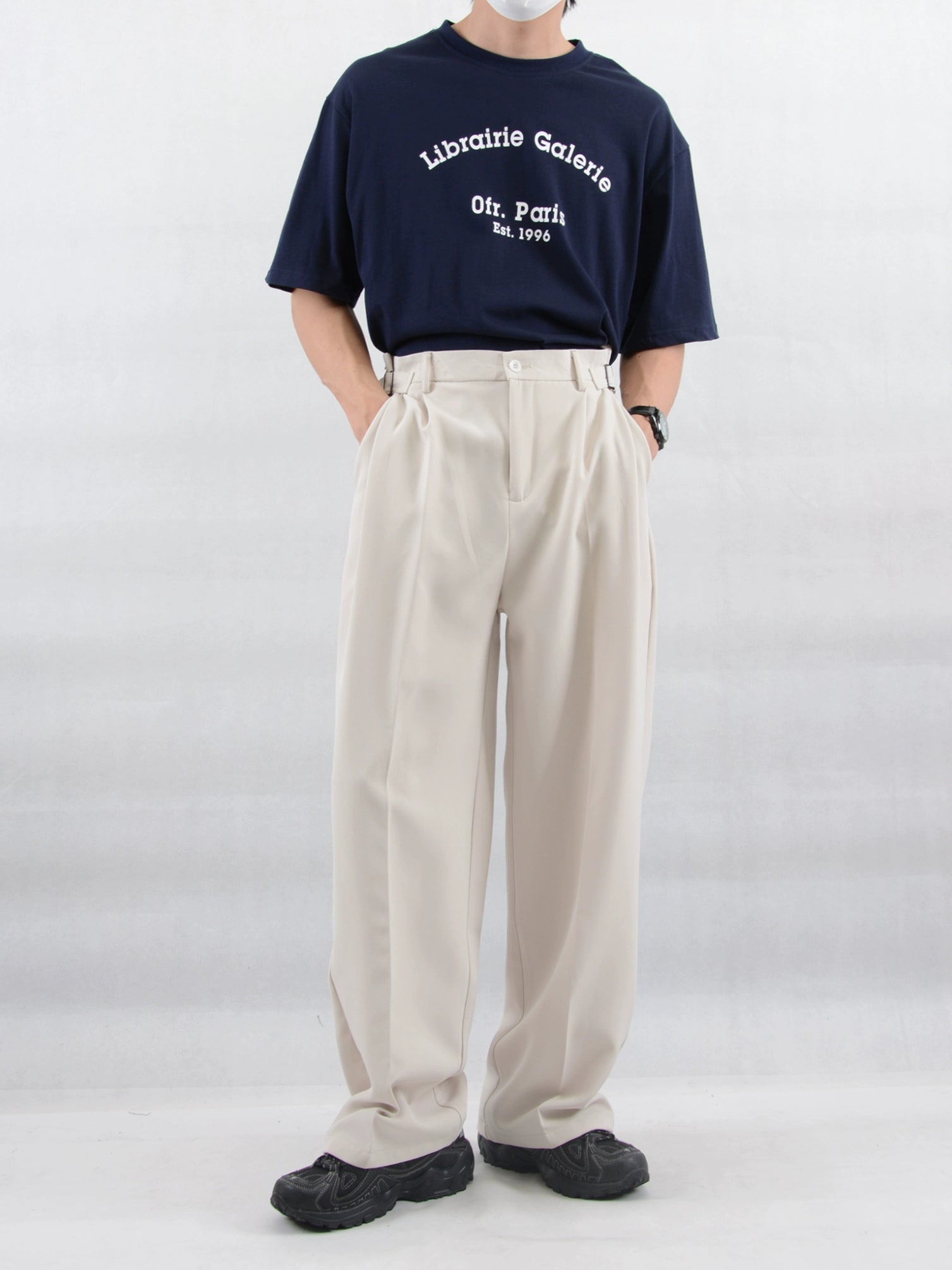 Wide Leg Pleated Trousers with Buckle Detail